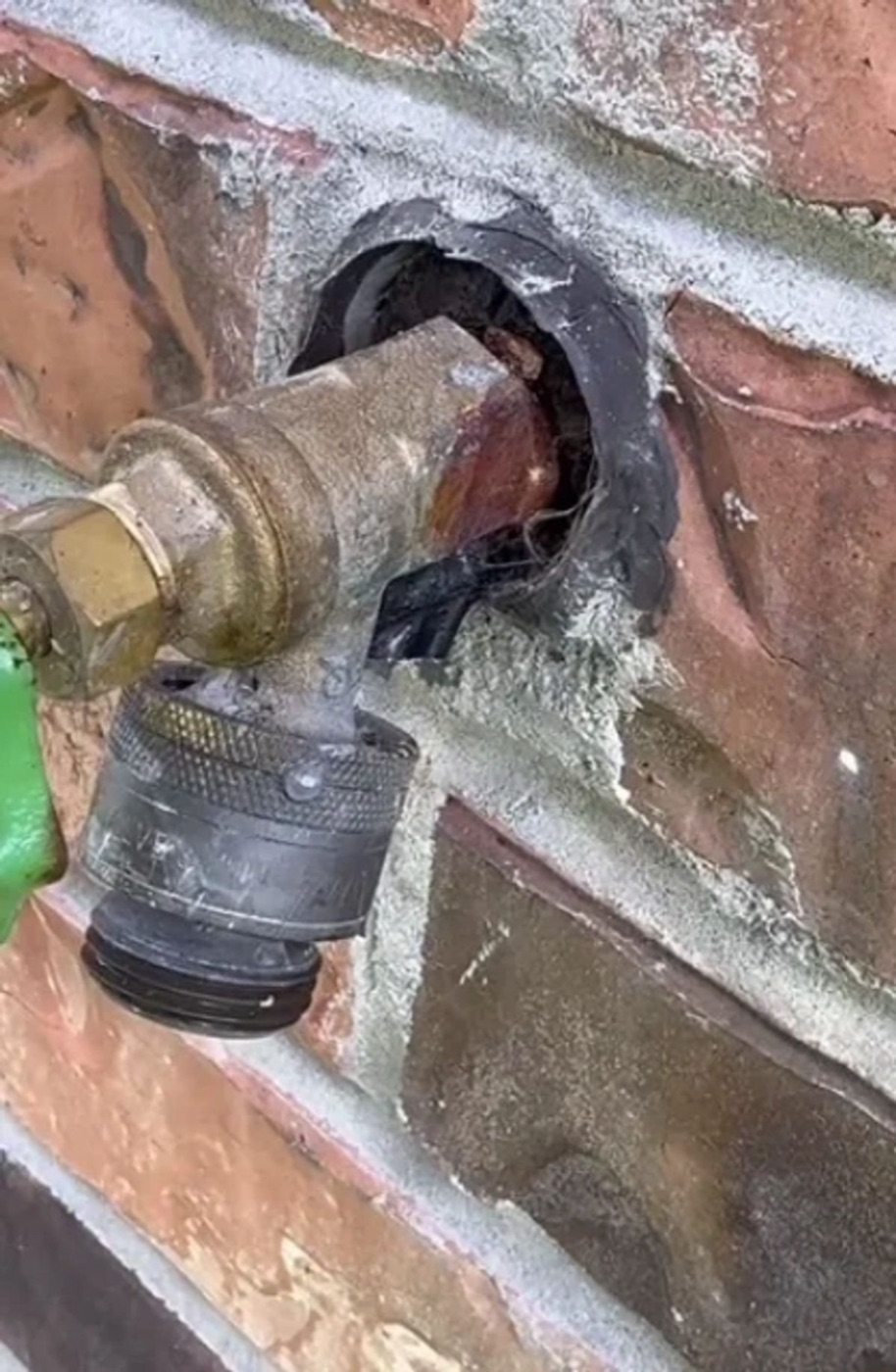 Corroded outdoor hose bib — before